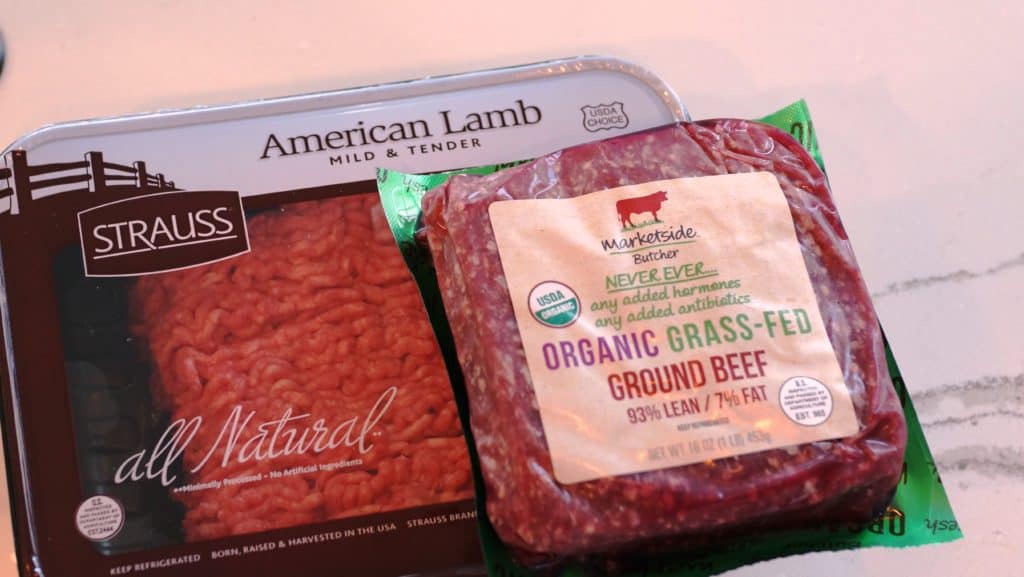 Packages of lamb and ground beef.
