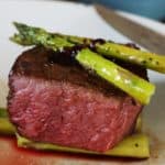 Teres Major Steak filet topped with asparagus and Malbec Sauce