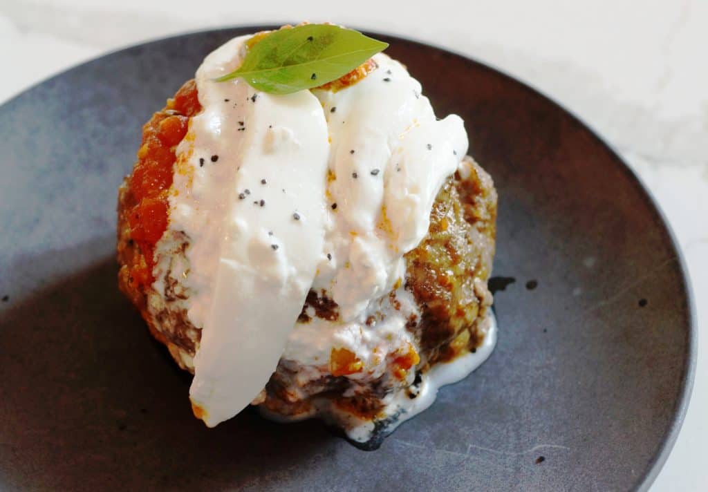 Giant smoked meatball topped with burrata.