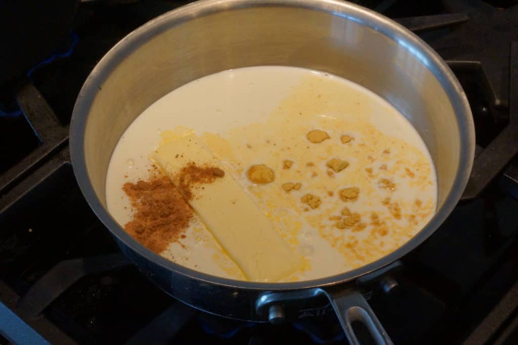 Sauce pan with ingredients for cheese sauce.