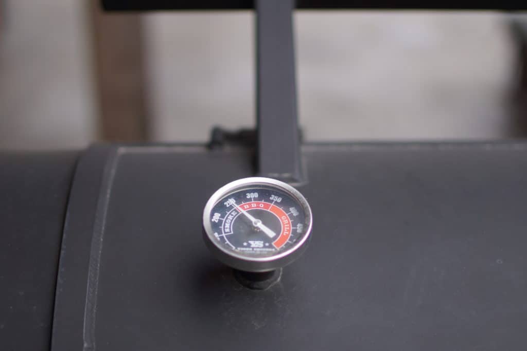 Temp gauge on a smoker, reading 250 degrees.