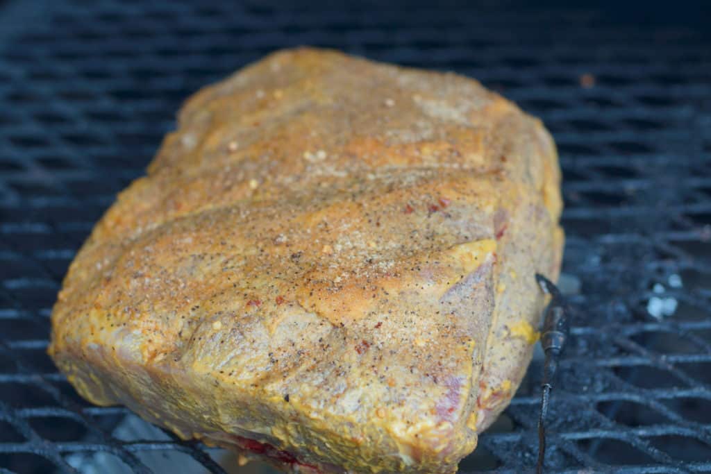 Boston butt cooking on a smoker.