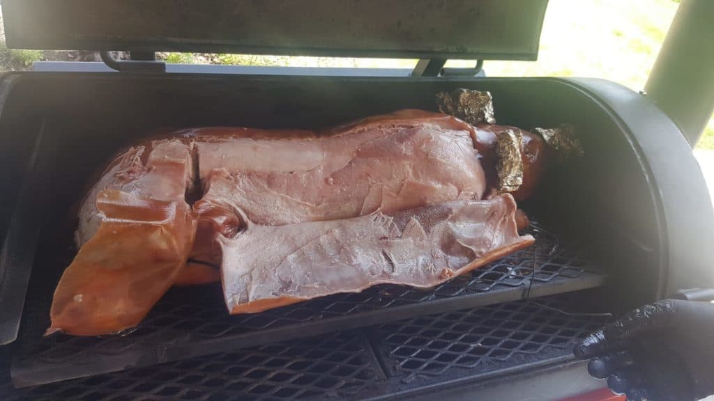 Whole hog cooking on a Yoder smoker.