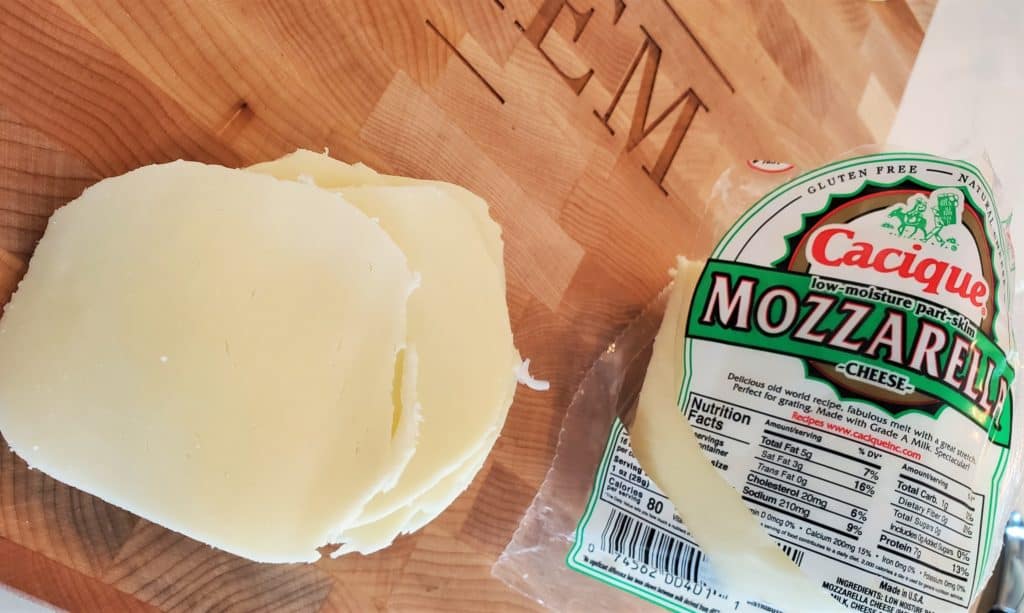 Slices of Cacique mozzarella cheese.