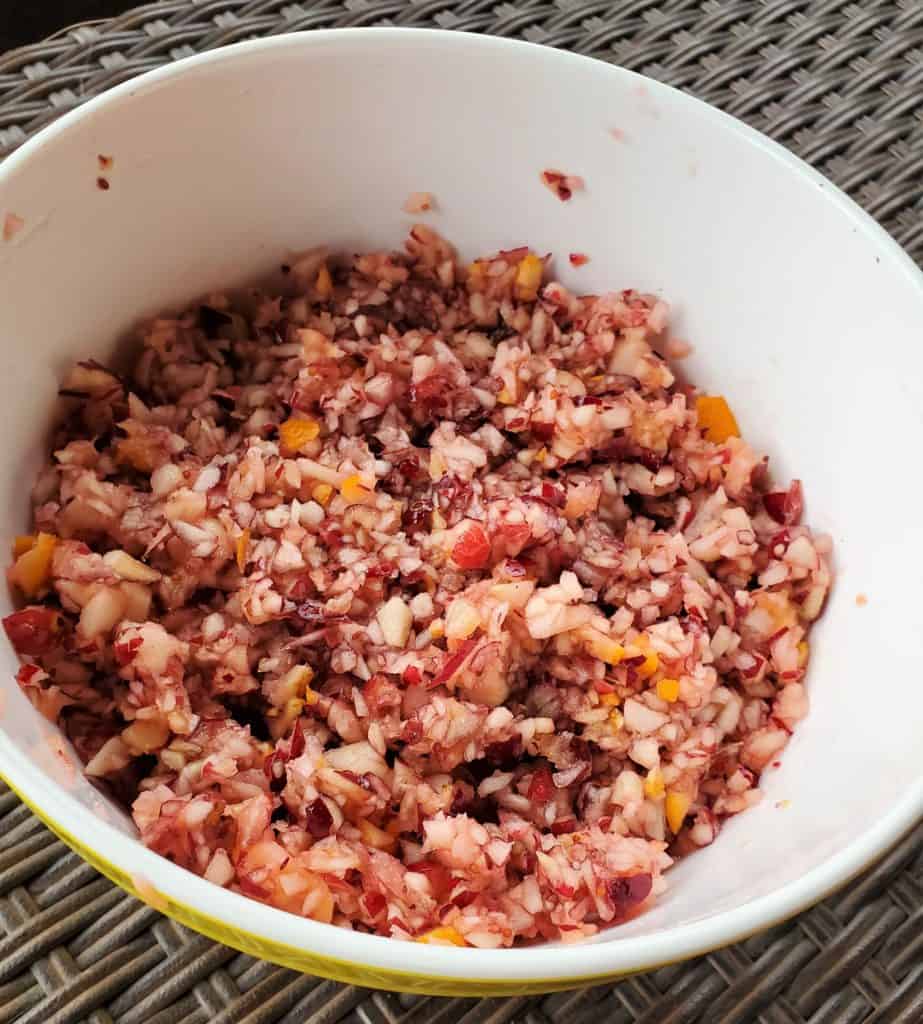 White bowl with Thanksgiving cranberry salad.