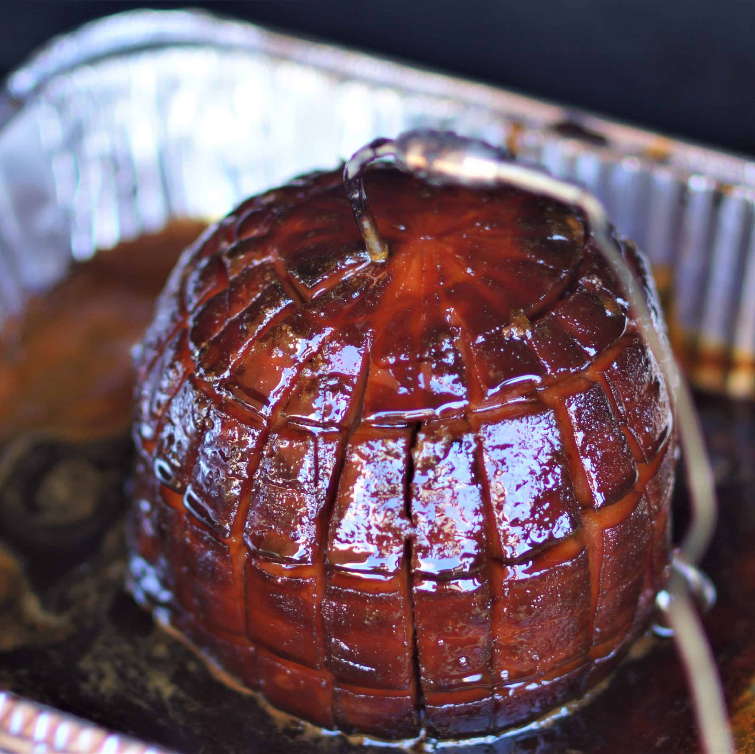 Close up of glazed black ham.