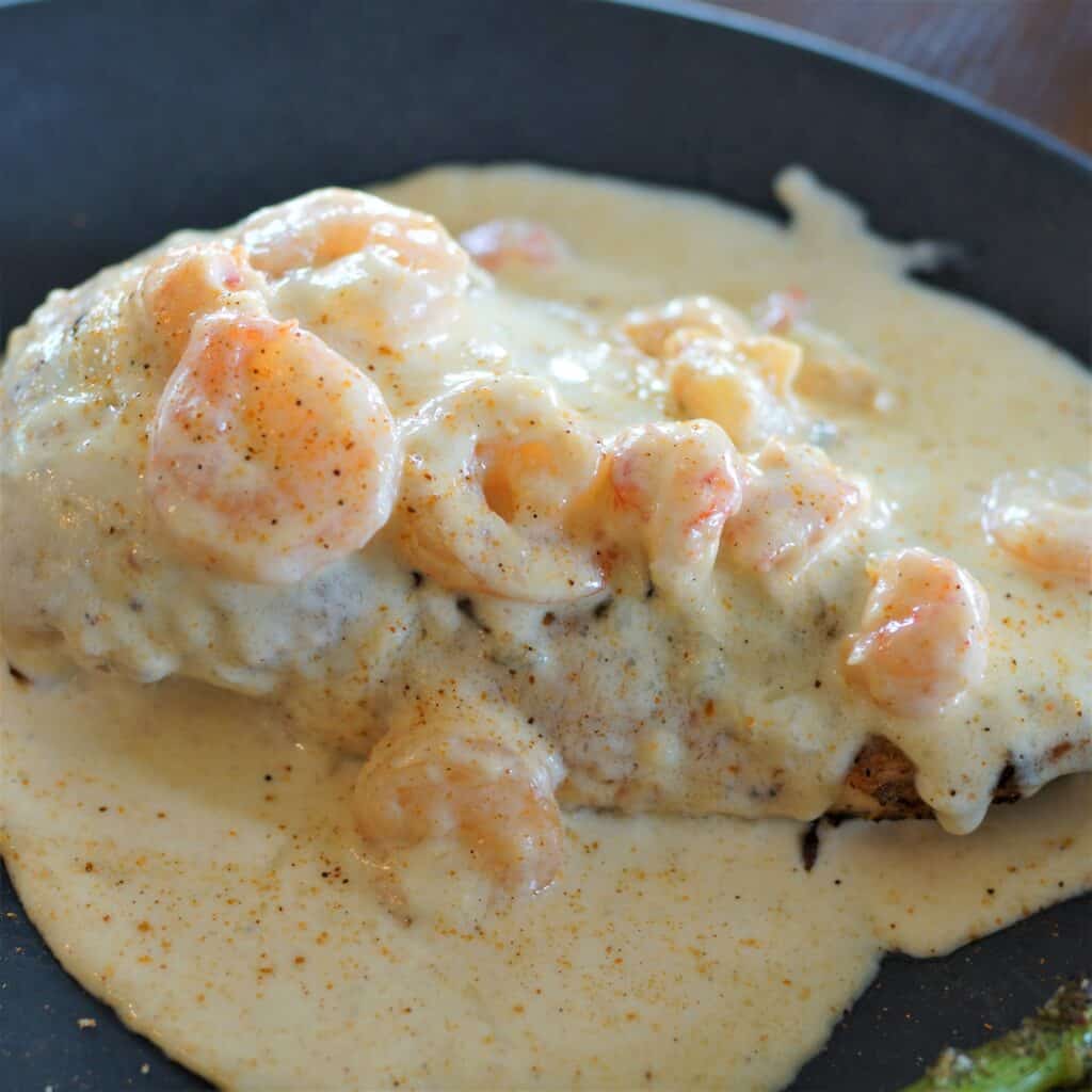 Blackened chicken with a seafood cream sauce.  Inspired by Chicken a la Mer from Jazz Louisiana Kitchen.