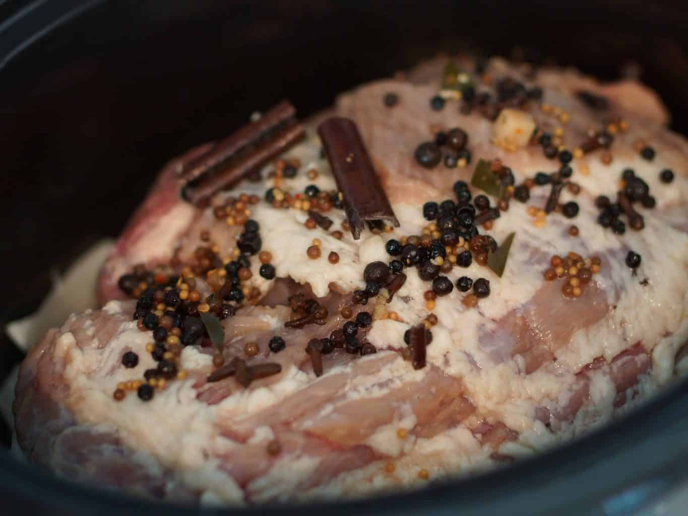Beer brined corned beef. cooking in a crock pot with spices.