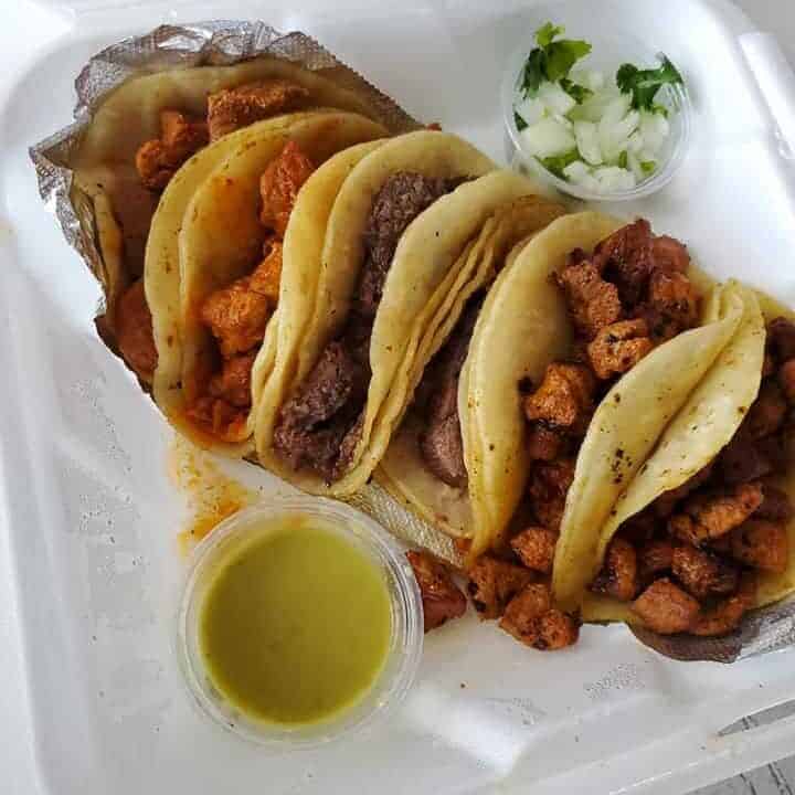 Tacos from El Pasa Del Norte, including their spicy Guisado Rojo.