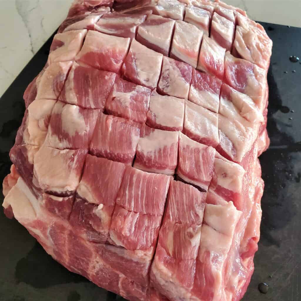 Scored pork butt