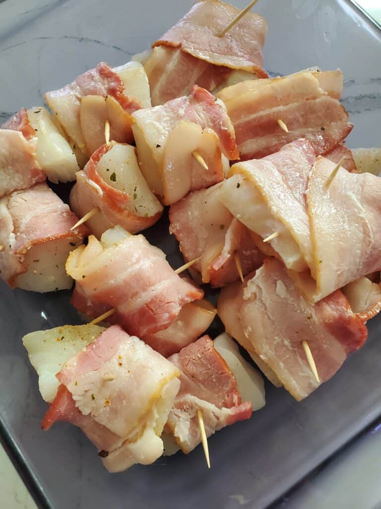 Tray of bacon wrapped halibut.