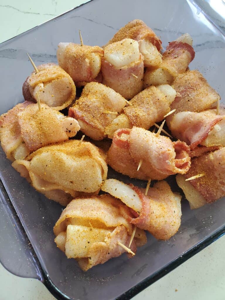 Bacon wrapped halibut cheeks seasoned with Holy Voodoo.