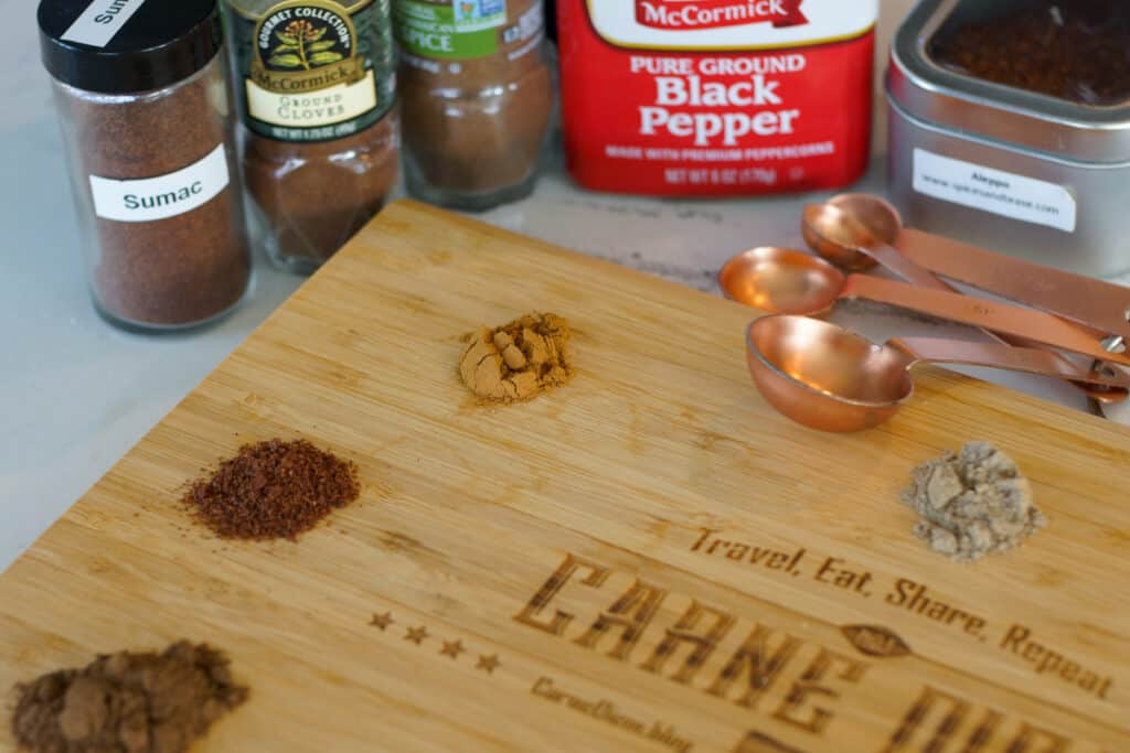 Spices for shawarma marinade on a cutting board.