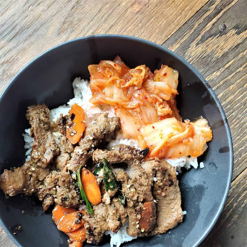 Korean grilled beef bulgogi, served with white rice and kimchi.