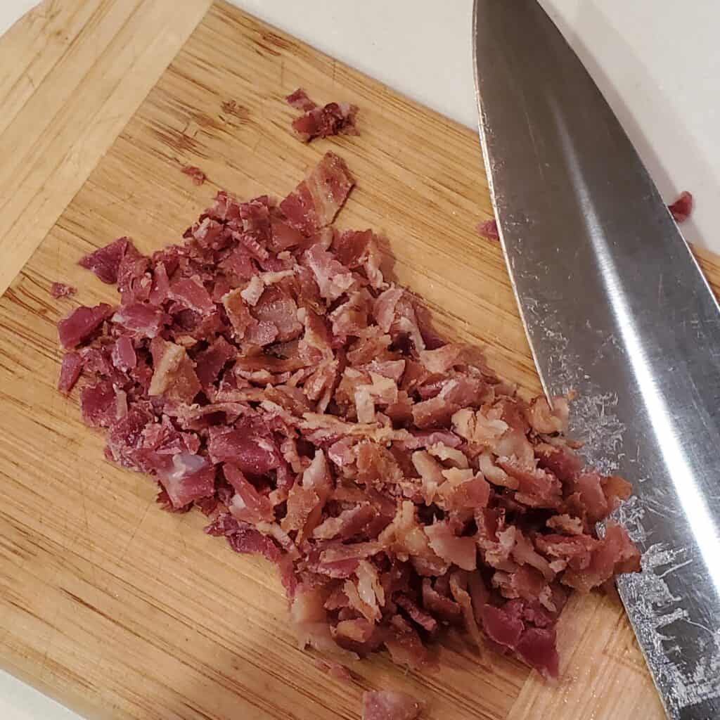 Bacon chopped on a cutting board.