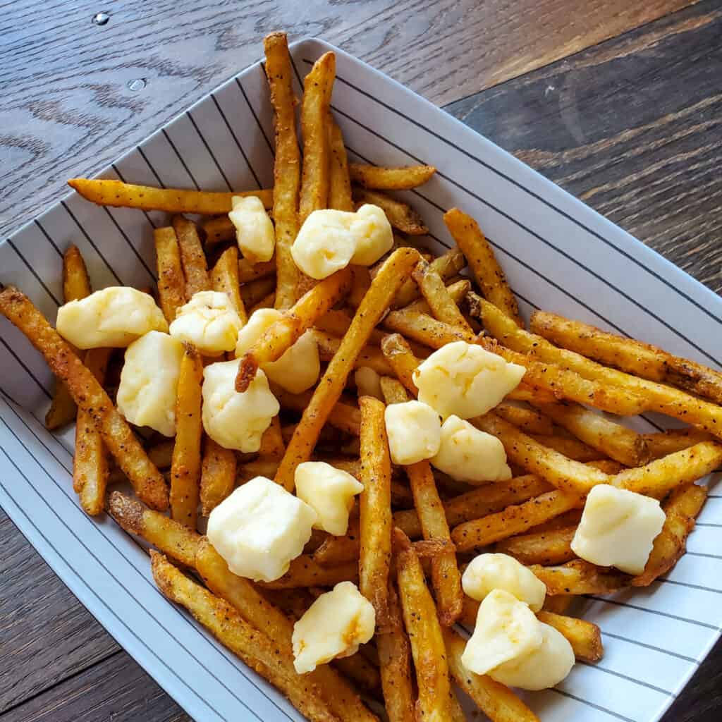 Crispy French Fries topped with cheddar cheese curds.