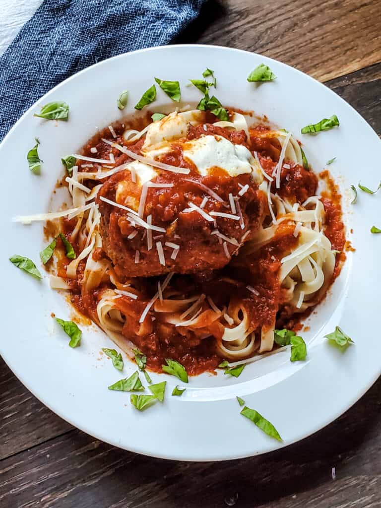 Giant smoked meatball served over pasta.
