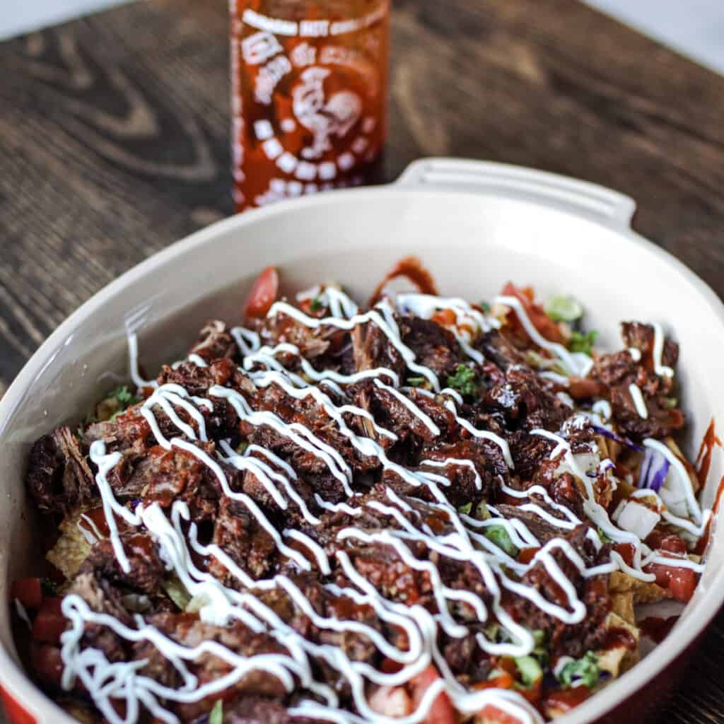 Platter with Asian inspired wonton nachos with braised short ribs.