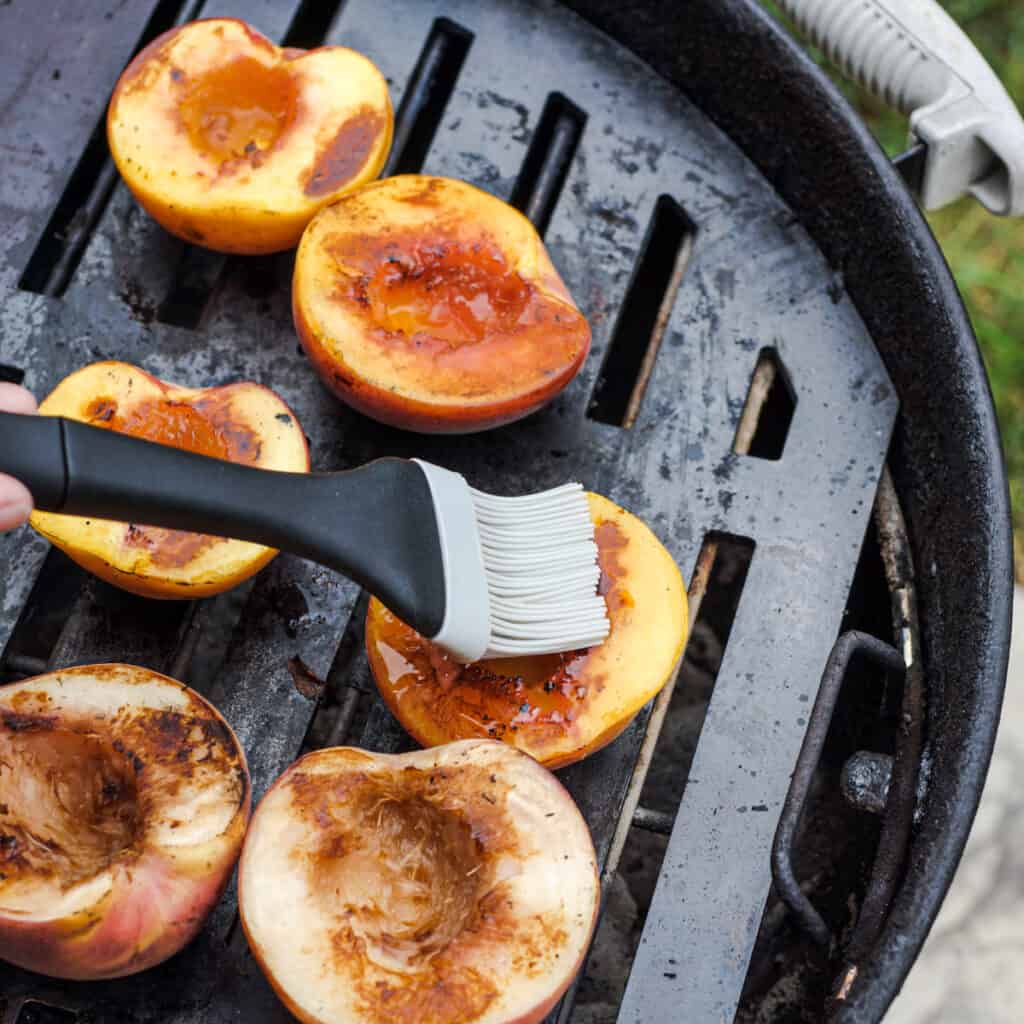 Basted grilled peaches with Amaretto butter.