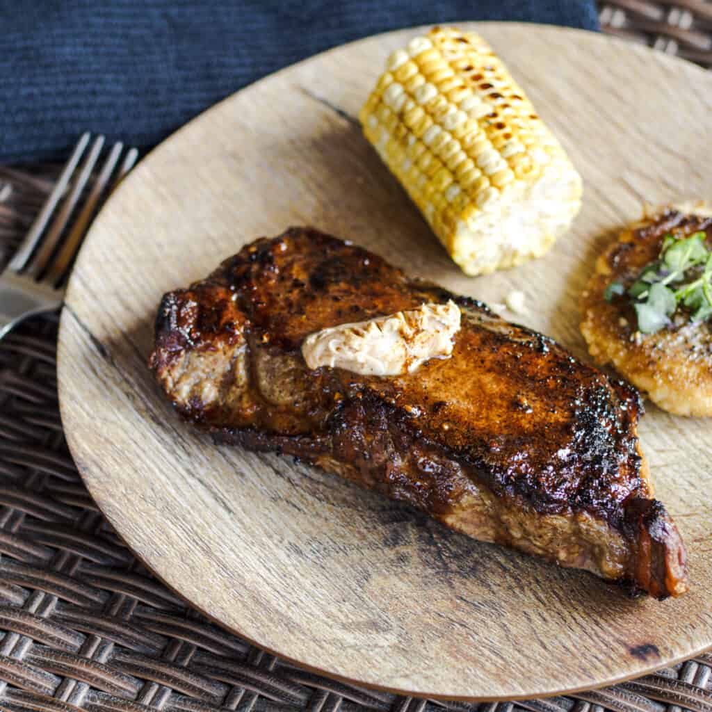 Seared steak topped with bone marrow compound butter.