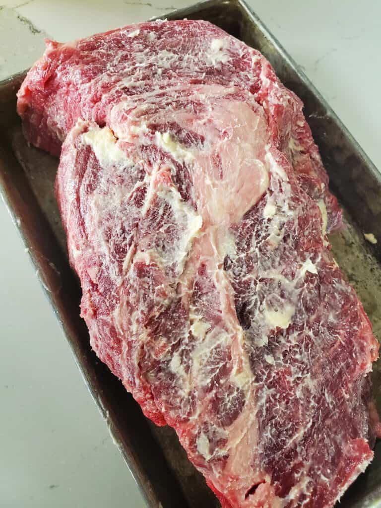 Beef chuck roast rubbed with butter and beef tallow.