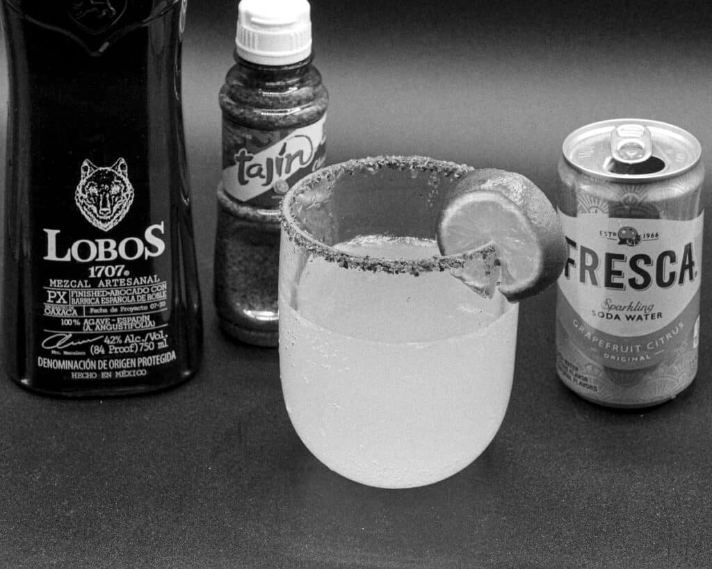 Black and white phot of Paloma cocktail made with Lobos mezcal.
