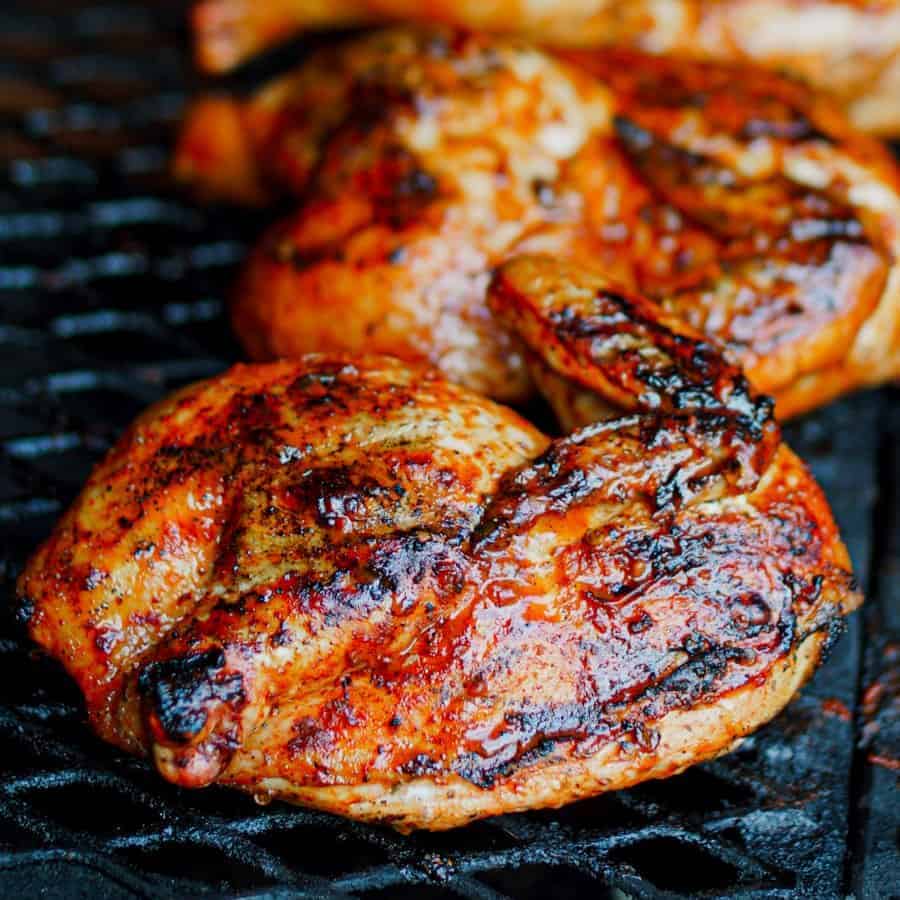 Perfectly grilled Pollo Asado al Carbon on a barbeque grill.