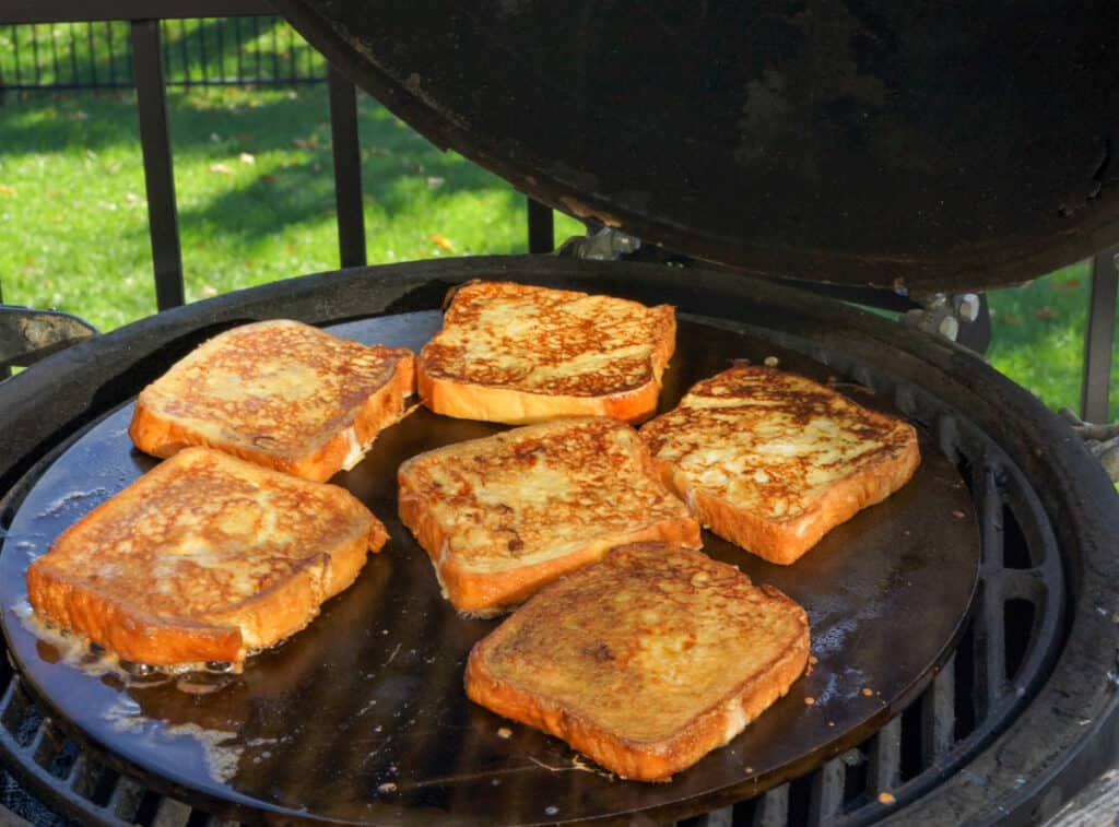 French toast cooking on an outdoor griddle