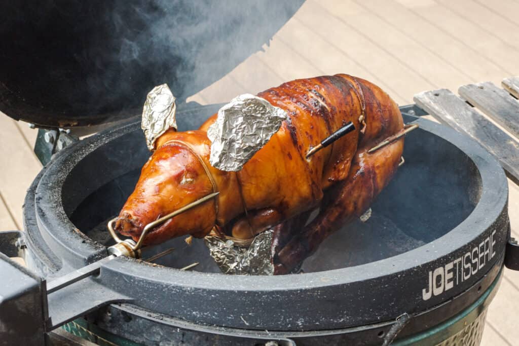 Suckling pig on a BBQ grill.