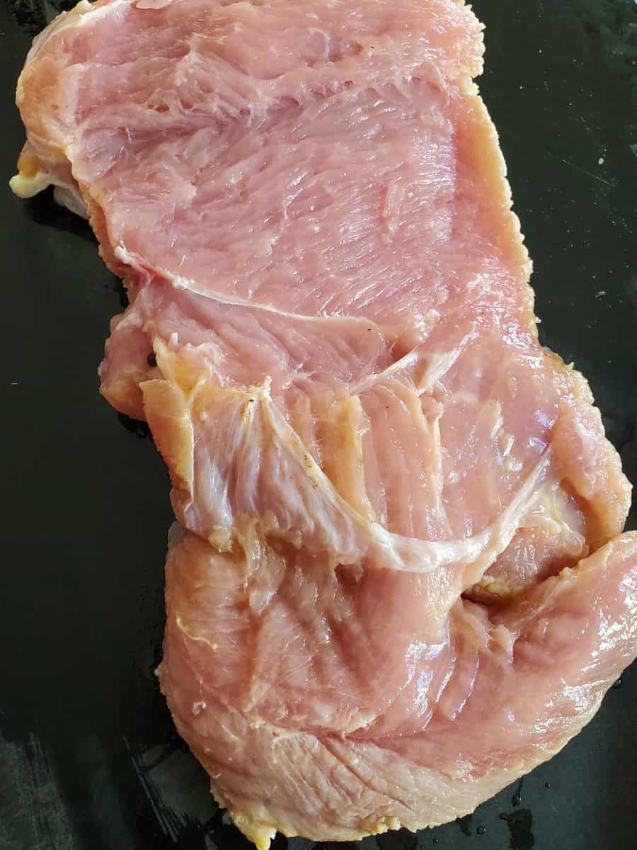 Thinly sliced turkey breast for turkey roulade.