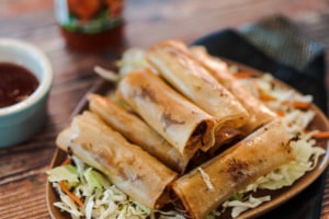 Pulled pork lumpia on a plate.