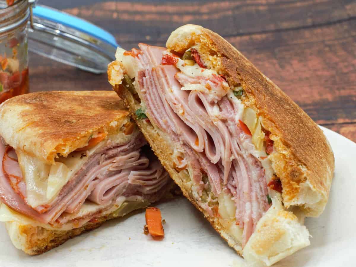 New Orleans style muffaletta sandwich, cut in half.