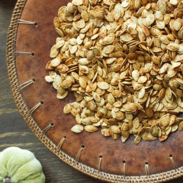 Smoked Pumpkin Seeds on a decorative plate.