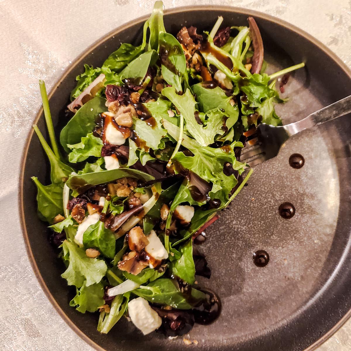 Christmas inspired salad in a gray bowl.