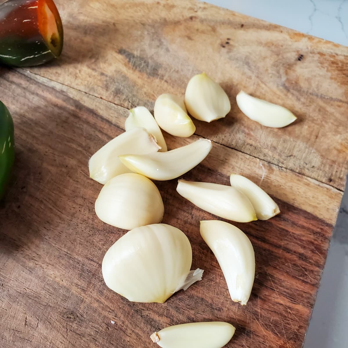Garlic cloves on a cutting board