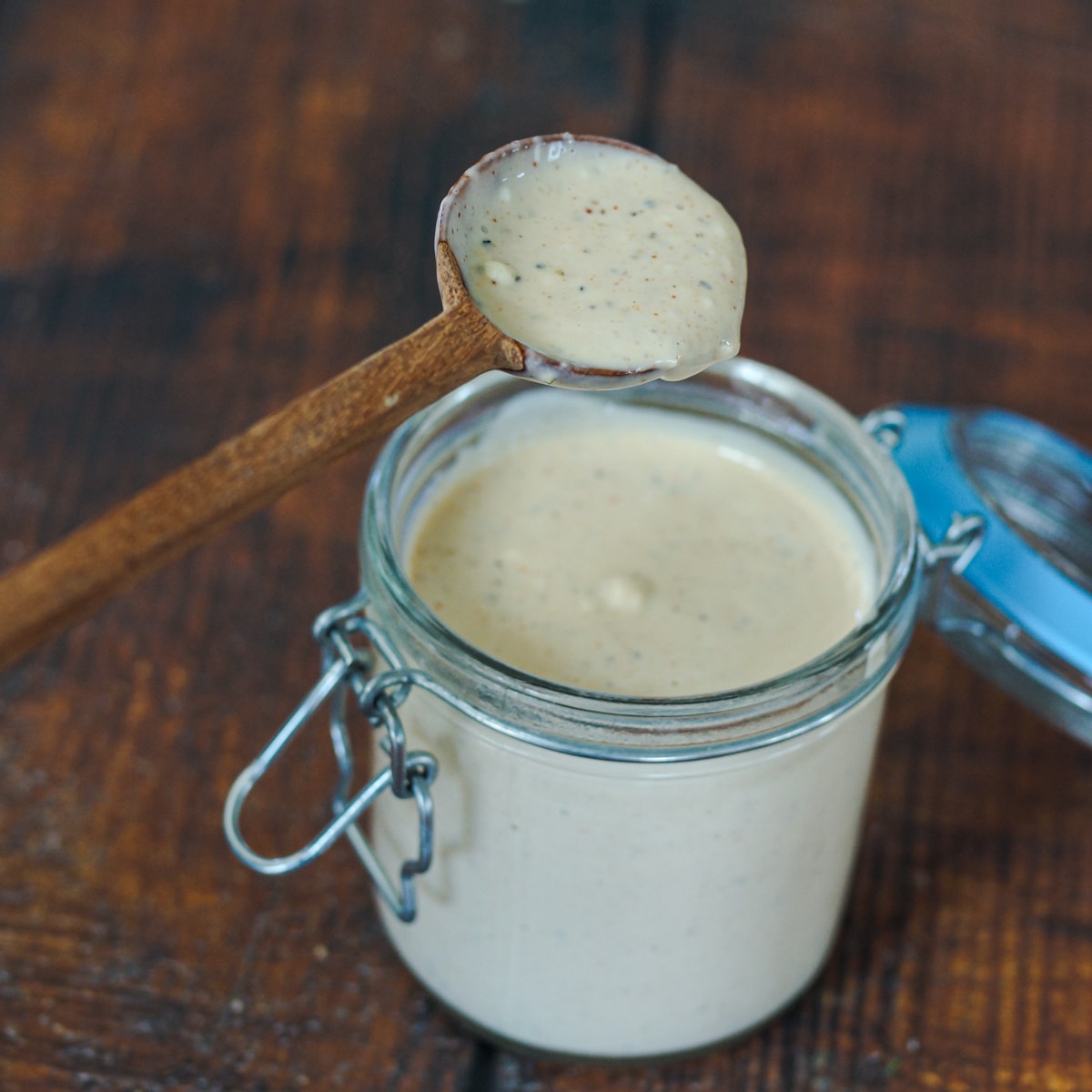 Jar of homemade Alabama White BBQ Sauce.