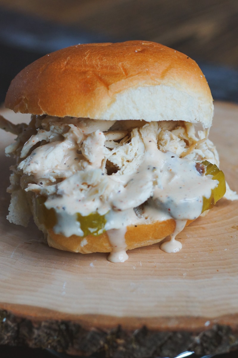 Pulled BBQ chicken sandwich with Alabama style white sauce.