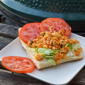 Cajun Crawfish Po' Boy with remoulade sauce, lettuce and tomatoes.