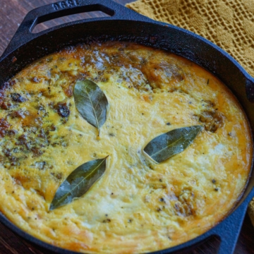 Authentic South African bobotie in a cast iron pan.