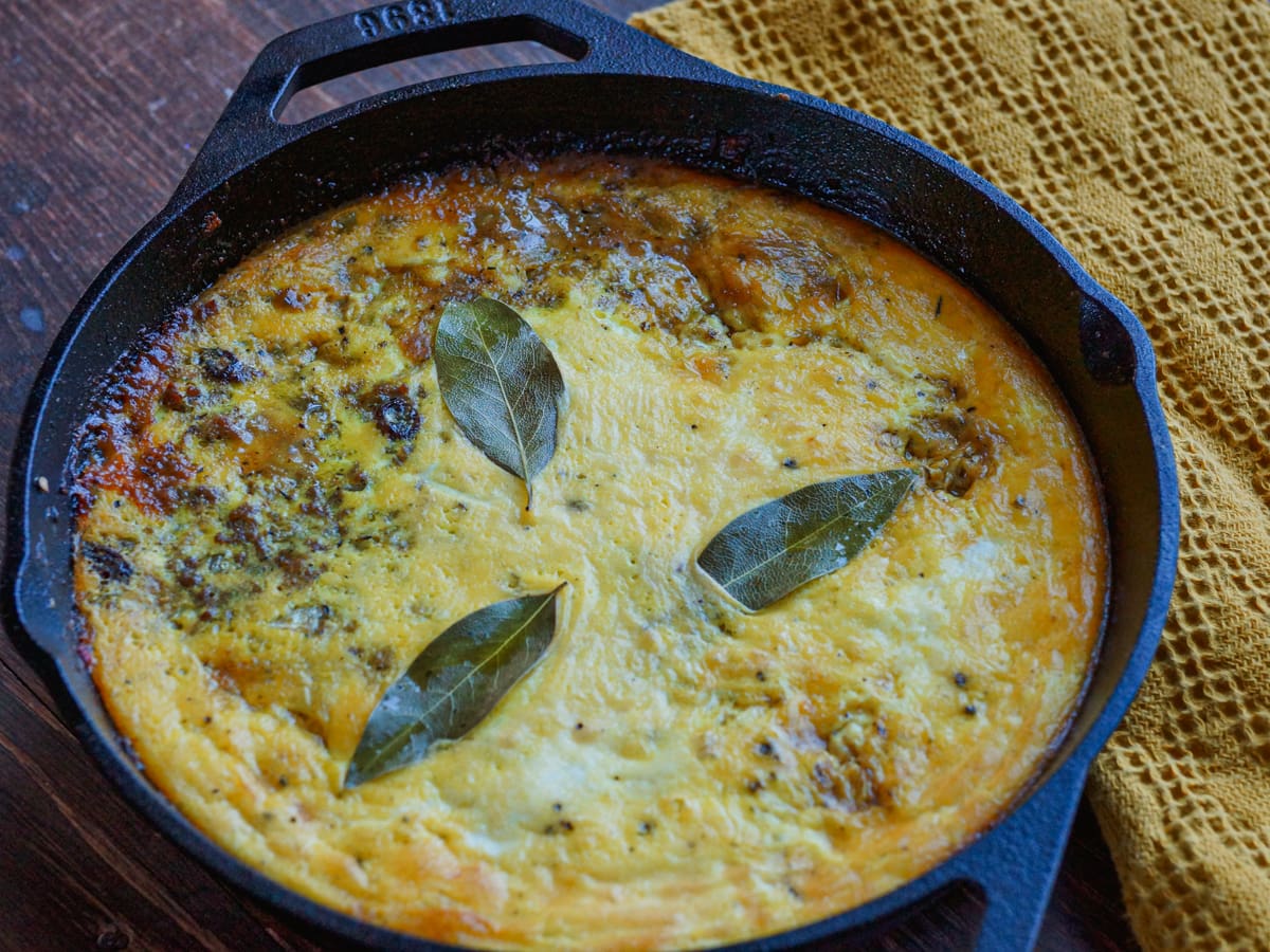 Authentic South African bobotie in a cast iron pan.