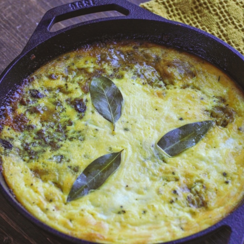 Cast iron skillet with baked bobotie.
