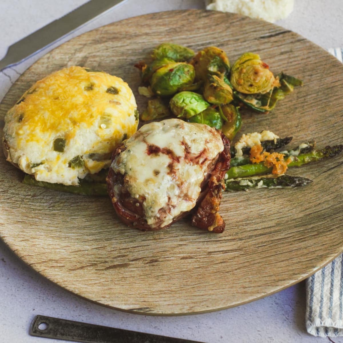 4 cheese crusted bacon wrapped filet with twice baked potato and Brussel sprouts.