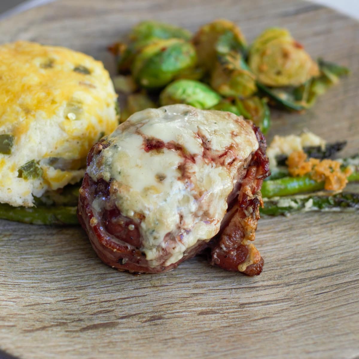 4 cheese crusted bacon wrapped filet with twice baked potato and Brussel sprouts.