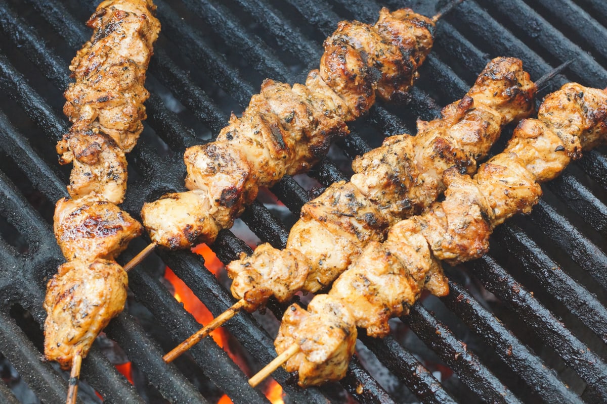 Grilled Shish Taouk skewers on a grill. 