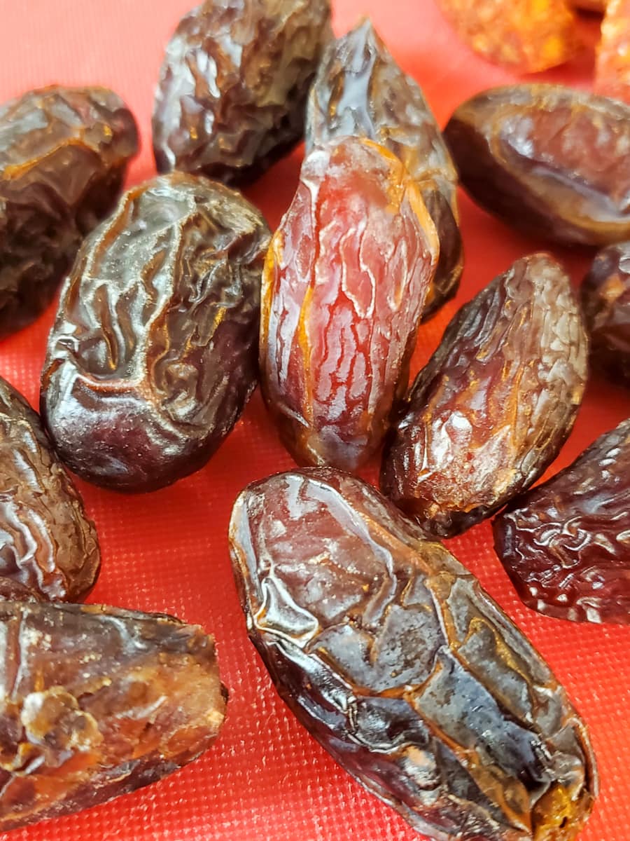 Medjool dates on a cutting board.