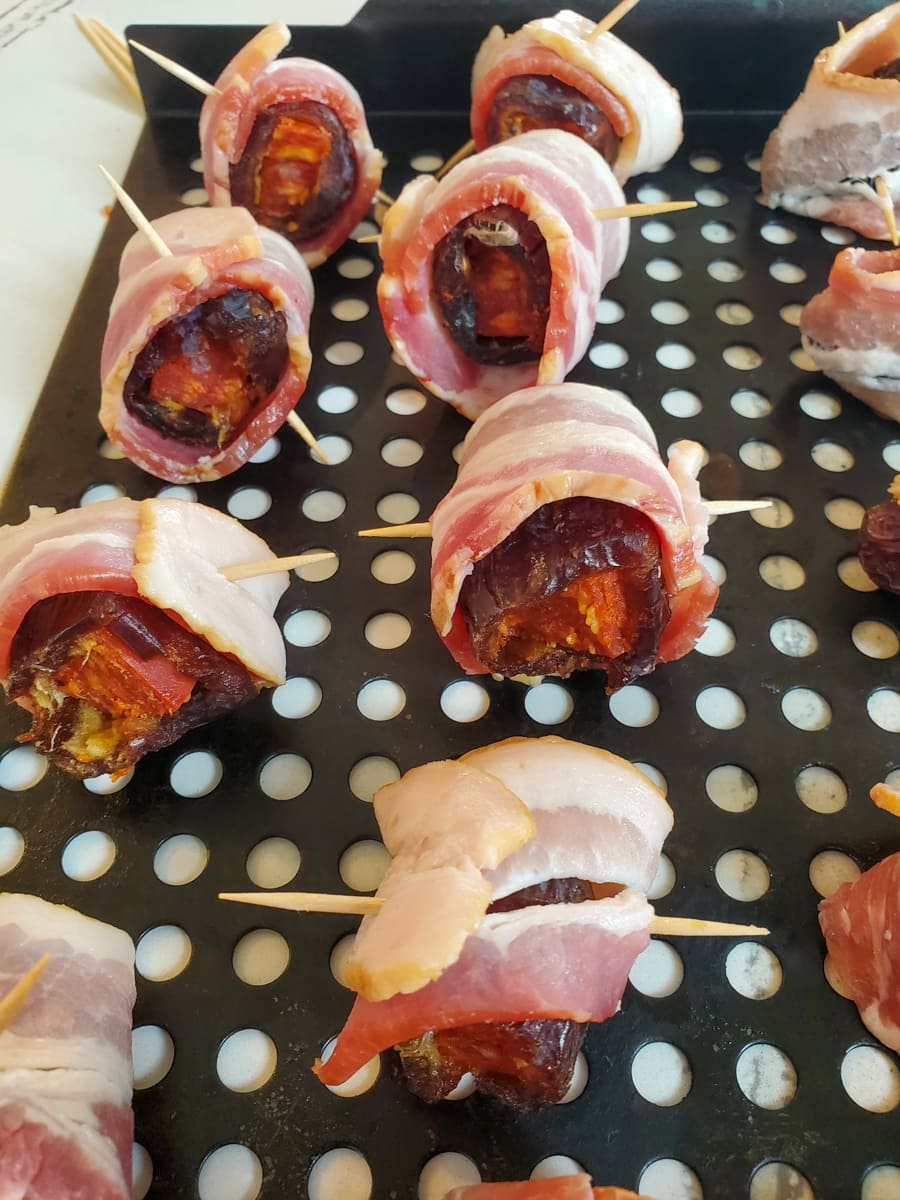 Spanish dates wrapped in bacon for a Devils of Horseback recipe.