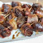 Grilled dates wrapped in bacon and stuffed with goat cheese and chorizo.