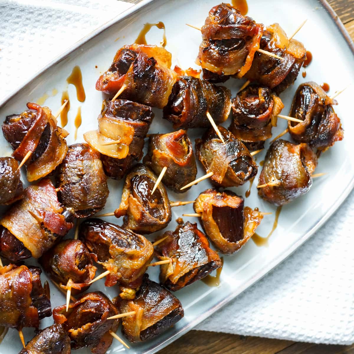 Grilled bacon wrapped dates stuffed with goat cheese and chorizo.