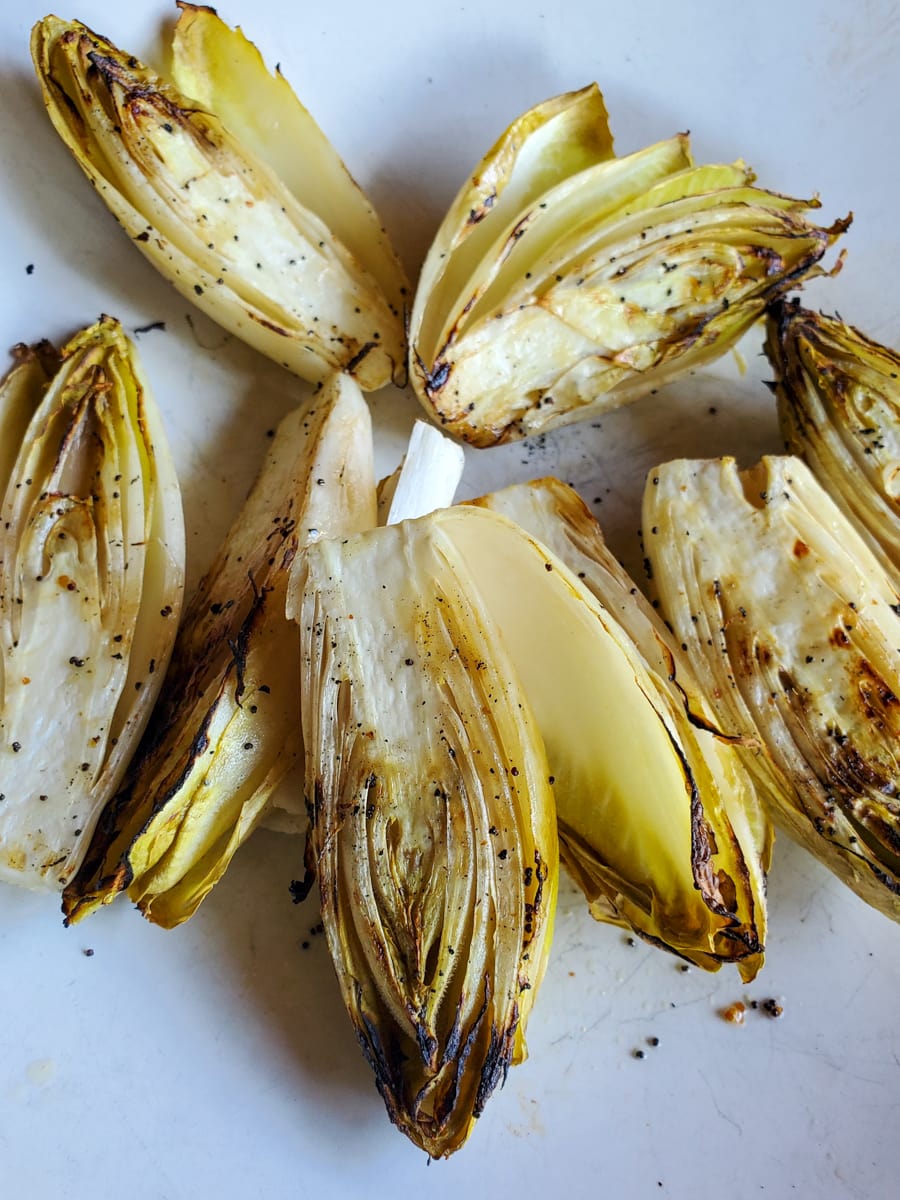 Grilled Belgian endive with a poppy seed dressing.