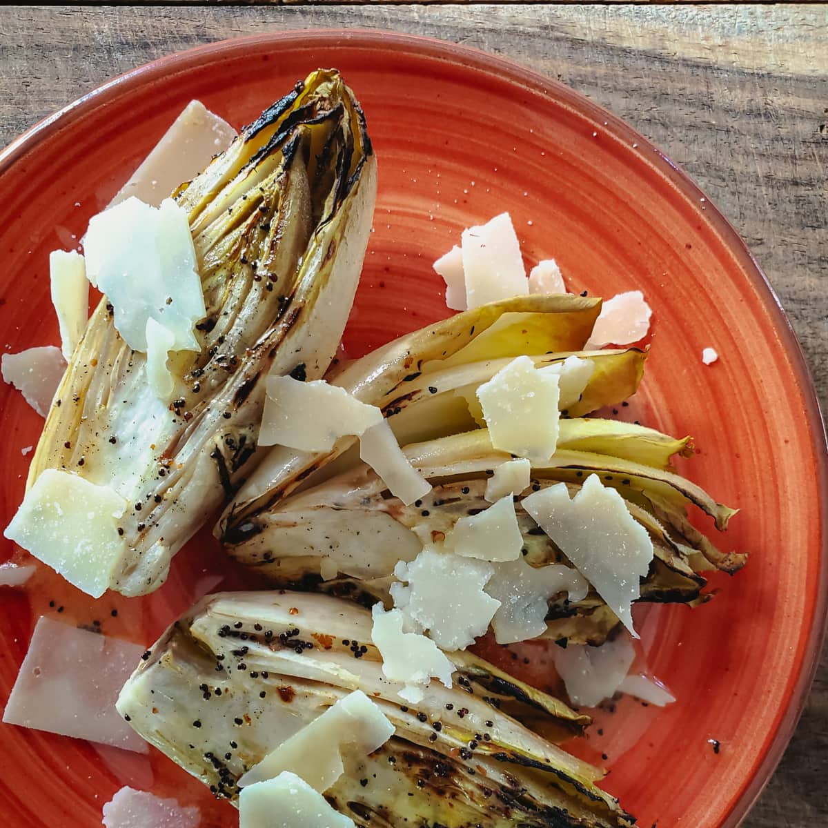 Summer salad with grilled endive and poopy seed dressing.